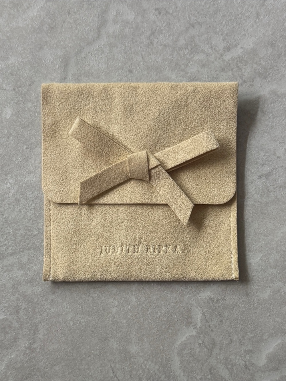 Judith Ripka Suede Pouch with Bow in Light Beige (4”H x 4”W)